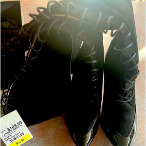 New with tag!! Beautiful black patten leather and suede strap up fashion boots!